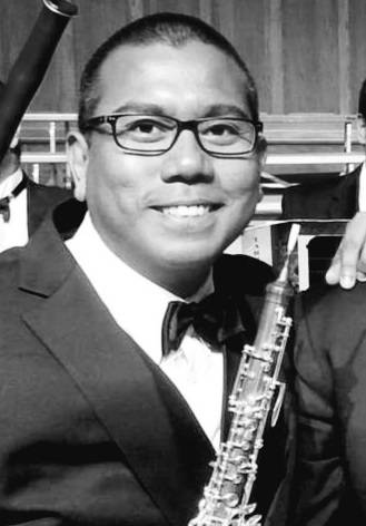 Mezraw Ramli holding his oboe.